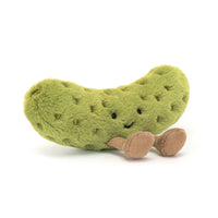 Plush pickle toy with a smiling face