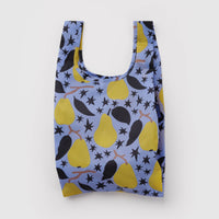 A reusable plastic bag with a blue background and a pattern of yellow pears, black leaves, and black stars, shown against a plain light gray background.