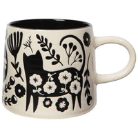 white mug with a black cat and floral design imprints