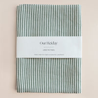 green striped linen tea towel with 'Our Holiday' label
