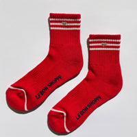 Red socks with white stripes and an embroidered heart