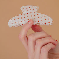 white hair claw with red polka dots