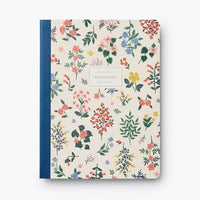 ruled notebook with blue spine and floral cover