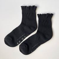 Pair of black socks with ruffles