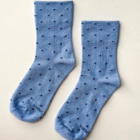 light blue socks with navy polka dots