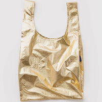 Gold metallic reusable bag on a light gray background