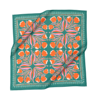 Floral patterned scarf with orange flowers on green fabric