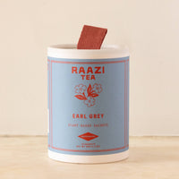 Raazi Tea Earl Grey packaging with a sachet on a beige background