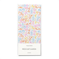 white tissue paper with colorful confetti