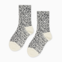 Pair of black and cream speckled socks with cream heels and toes