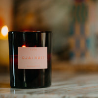 balsam fir, fig leaf, sandalwood, and amber scented candle