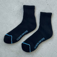 black womens socks with light blue stripe across the toe box