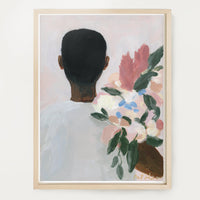 a framed art print of a black man holding flowers 