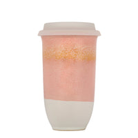 ceramic travelcoffee cup with pink orange and beige gradient design 