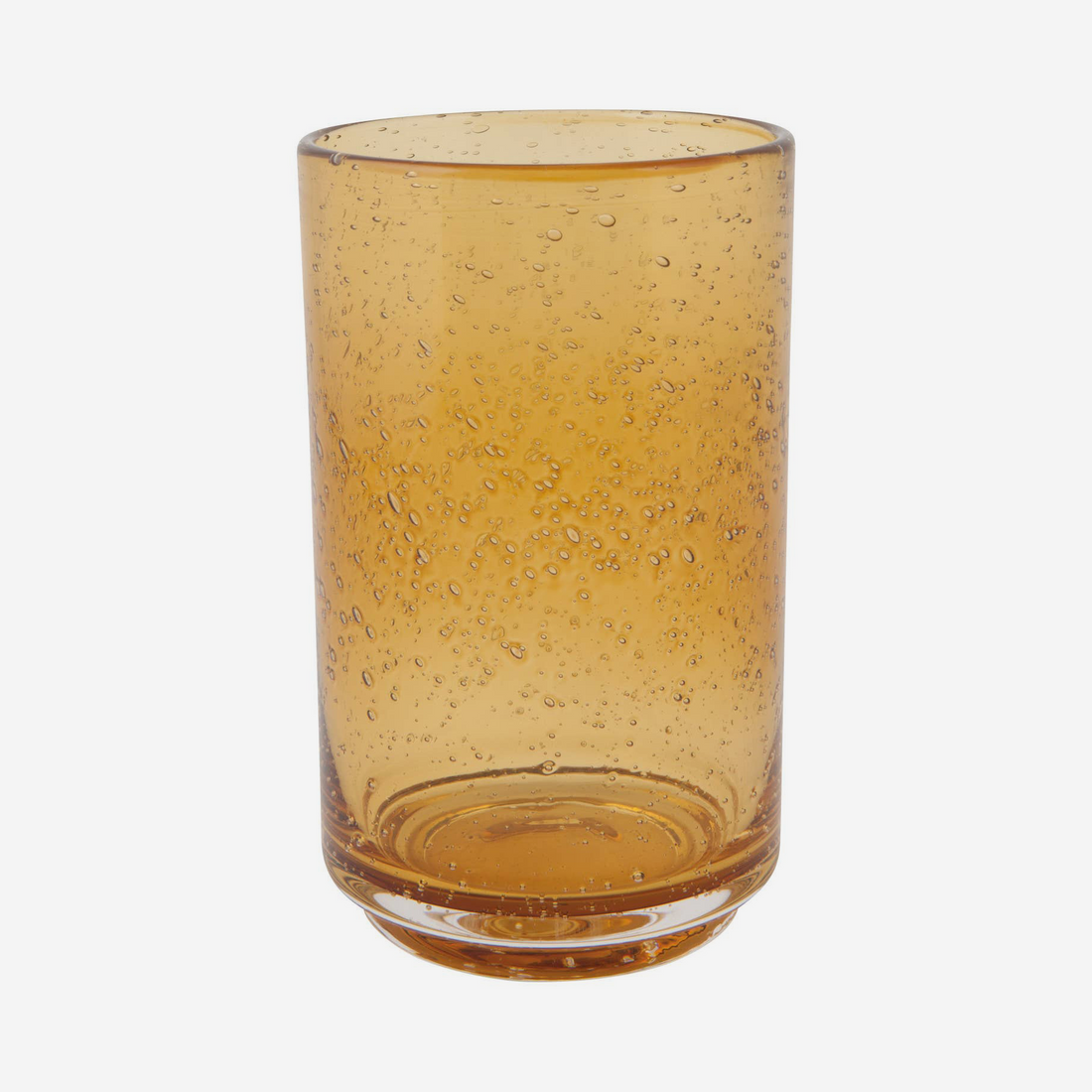 An amber-colored glass tumbler with a textured, bubbly seersucker pattern