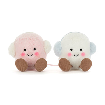 two tethered pink and white marshmallow plush toys with ear muffs 