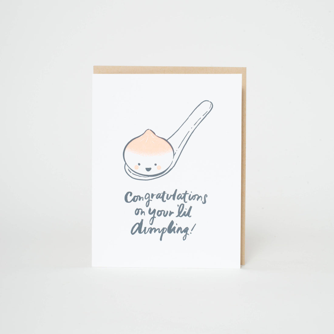 Greeting card featuring a spoon with a smal dumpling and text 'Congratulations on your lil' dimpling' 