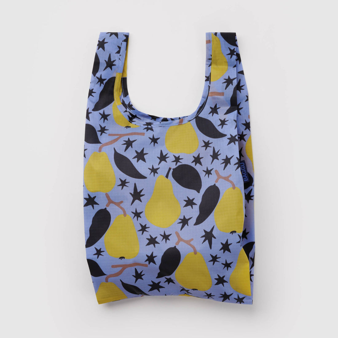 A reusable plastic bag with a blue background and a pattern of yellow pears, black leaves, and black stars, shown against a plain light gray background.