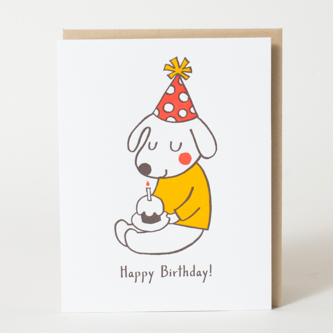 Cartoon dog in a party hat with a birthday cupcake and candle 