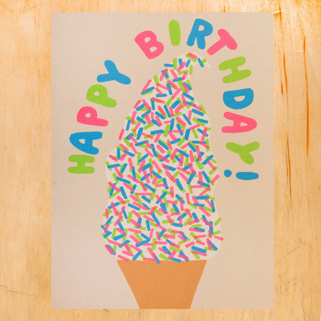 Birthday card with ice cream cone and colorful sprinkles