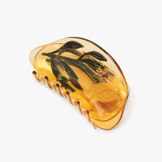 Orange hair clip with floral design 