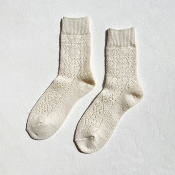 cream cashmere socks by le bon shoppe with a pattern
