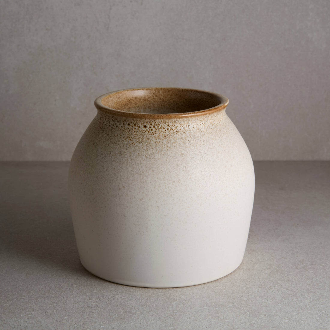 White ceramic vase with brown accents 