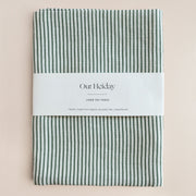 green striped linen tea towel with 'Our Holiday' label
