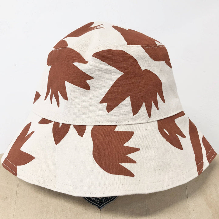 Bucket hat with brown lotus pattern