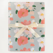 coral floral bloom wrapping paper with a soft blue background