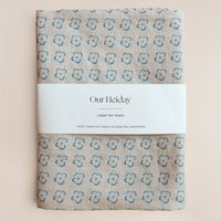 neutral tea towel with cornflower blue florals