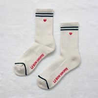 Pair of cream-colored socks with red embroidered hearts 