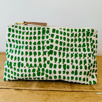 Green and white spotted patterned fabric clutch