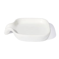 white ceramic dish with dipped end