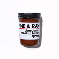 Jar of chocolate hazelnut butter spread with a label on a white background