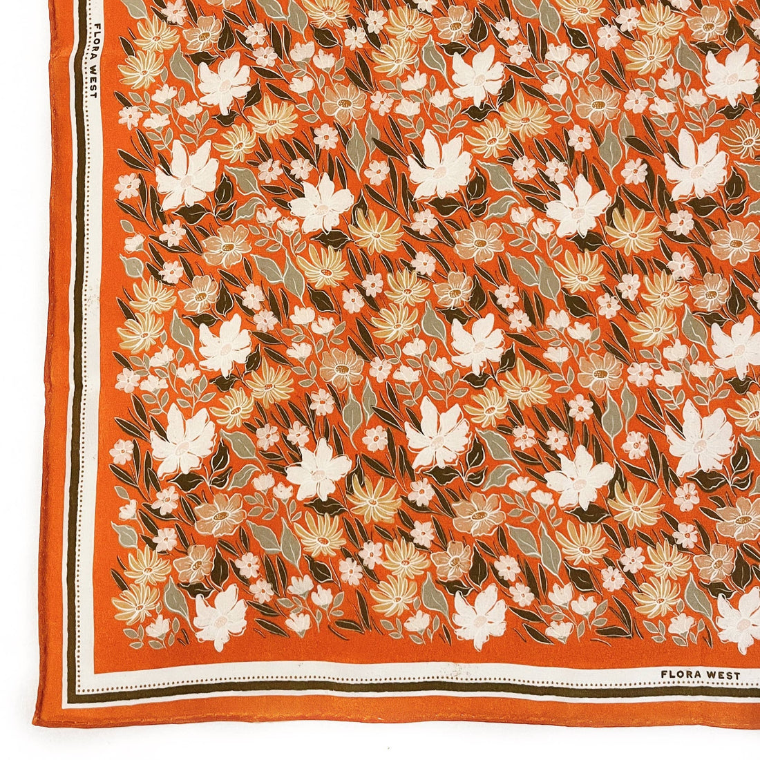 orange silk scarf with pops of white and green coloring