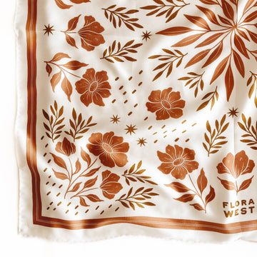 white silk scarf with dark tan floral and foliage prints