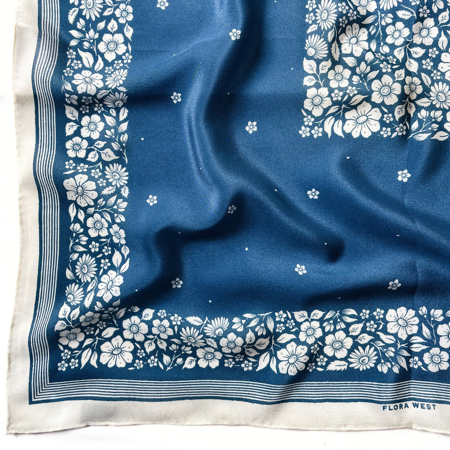 blue silk scarf with white floral designs