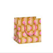Small gift bag with pink and beige pattern with circles