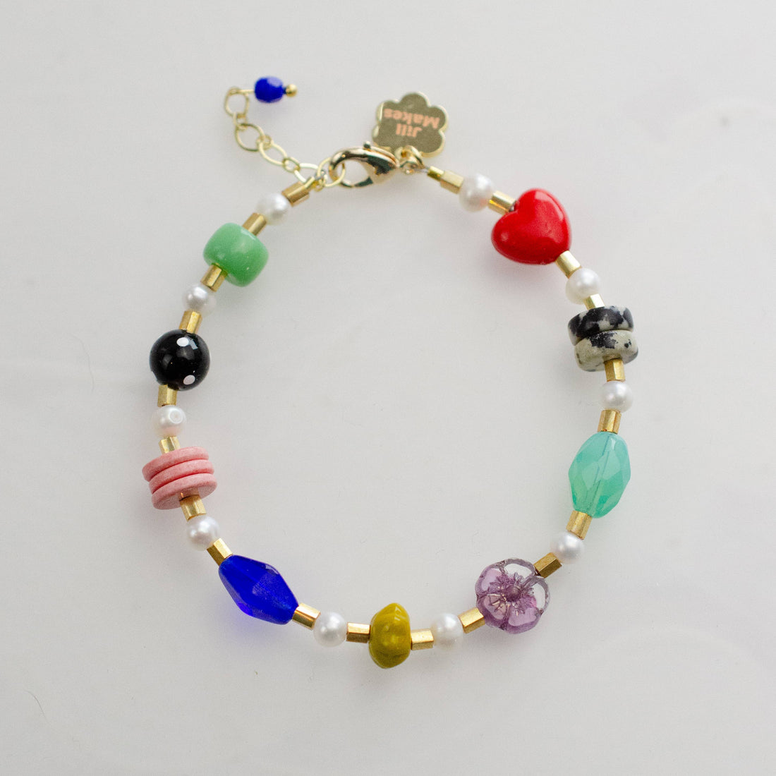 Colorful beaded bracelet with heart charm 