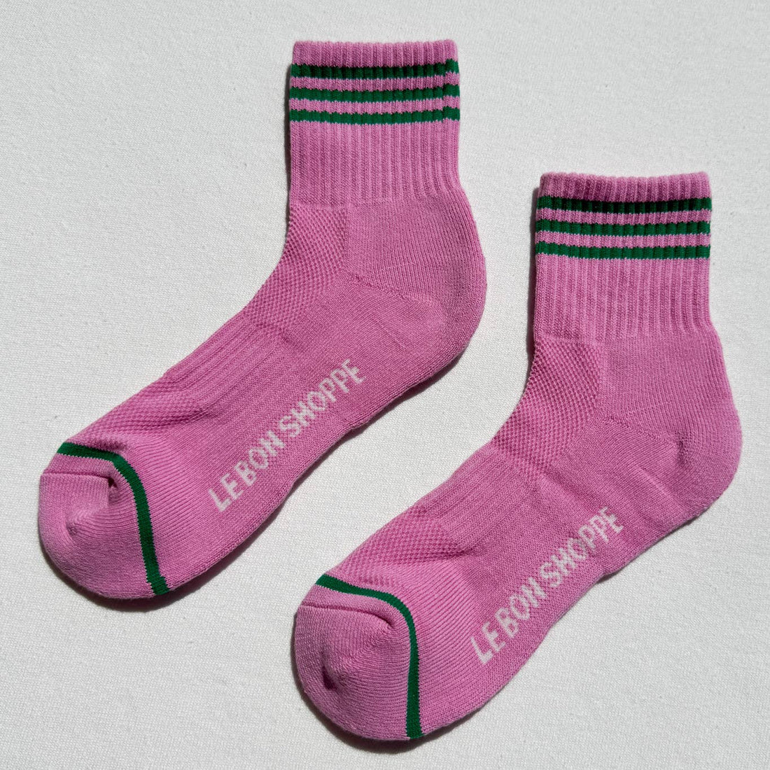 Pink socks with green stripes