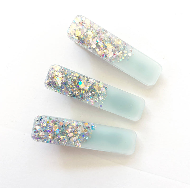 glitter hair clips in the color of blue and silver