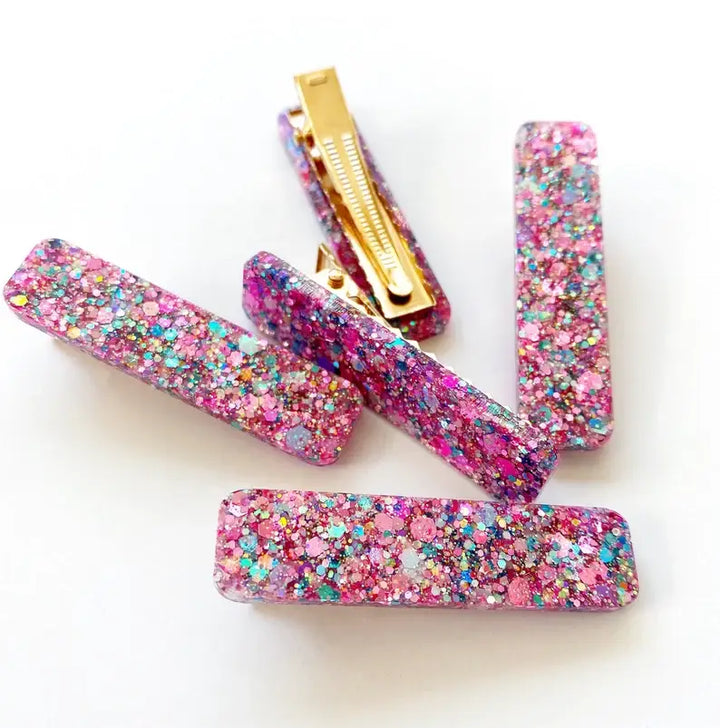 glitter hair clips in the color of pink and gold