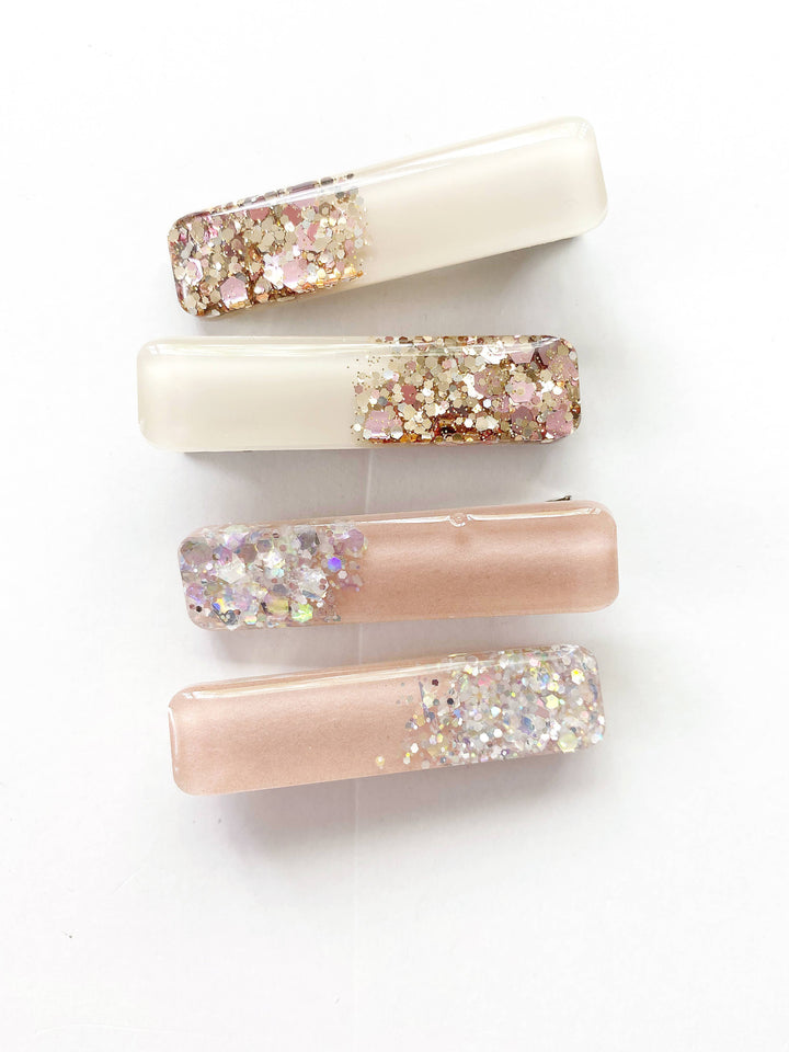 glitter hair clips in the color of pink and mauve