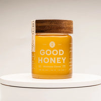 Jar of Montana Clover honey by Good Honey with a wooden lid