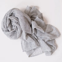 cotton scarf with white background and small dark spots