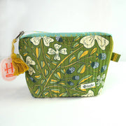 Green floral-patterned pouch with a tassel 