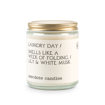 laundry day candle with lily and white musk scent notes