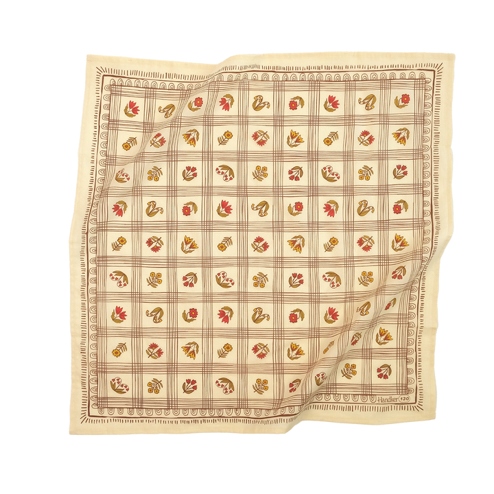Patterned beige cotton bandana with a checkered design and florals