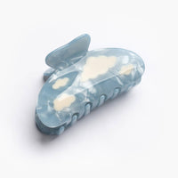 Blue hair claw with cloud designs 